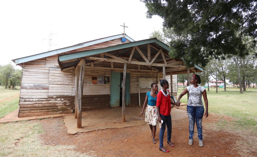 Maria Njeri (right), one of Garissa University terror attack survivors who were transferred to Moi University in Eldoret with friends in this picture taken at Moi University Grace Chapel after an afternoon prayer fellowship on April 1, 2016. (Billy Mutai/GroundTruth)                             