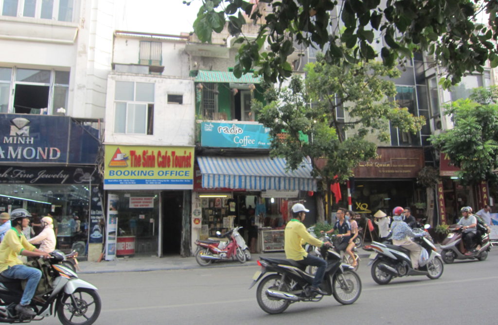 People ride by on motorbikes in Hanoi, Vietnam. (Photo by Joanne Silberner/GroundTruth)