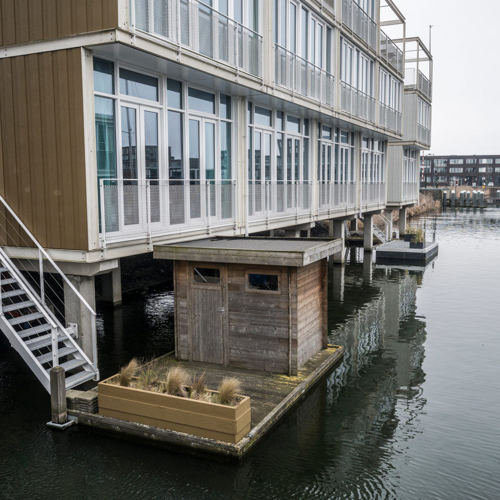 IJburg is a neighborhood of floating houses on the eastern edge of Amsterdam. A floating garden shed and plants are pictured. (Photo by Joris van Gennip/The GroundTruth Project)