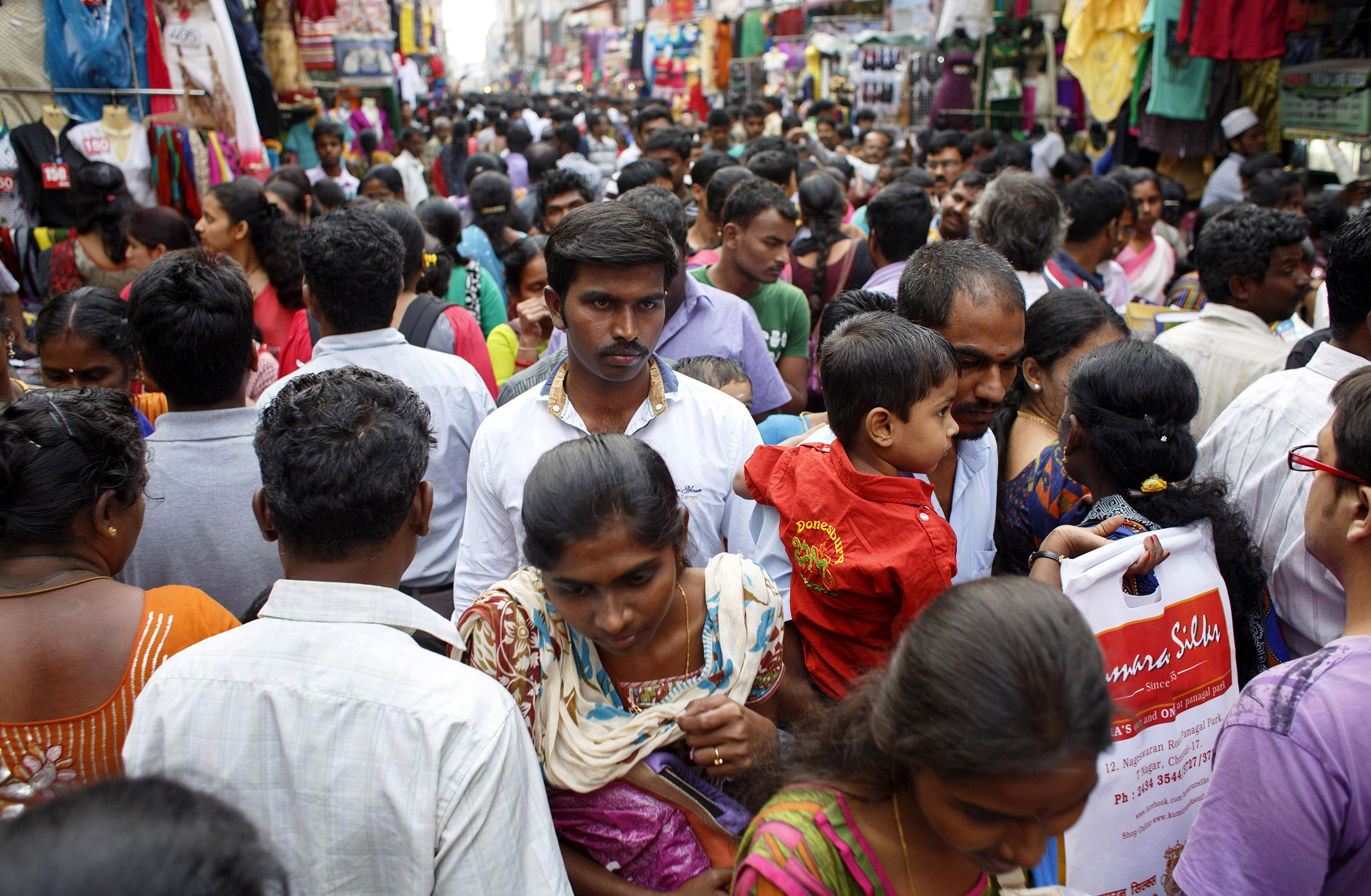 Crowds make their way through the Theagaraya Nagar Market in Chennai, India, in December 2014. India is the second most populous country in the world; rapid population growth has been a concern of the government for decades.