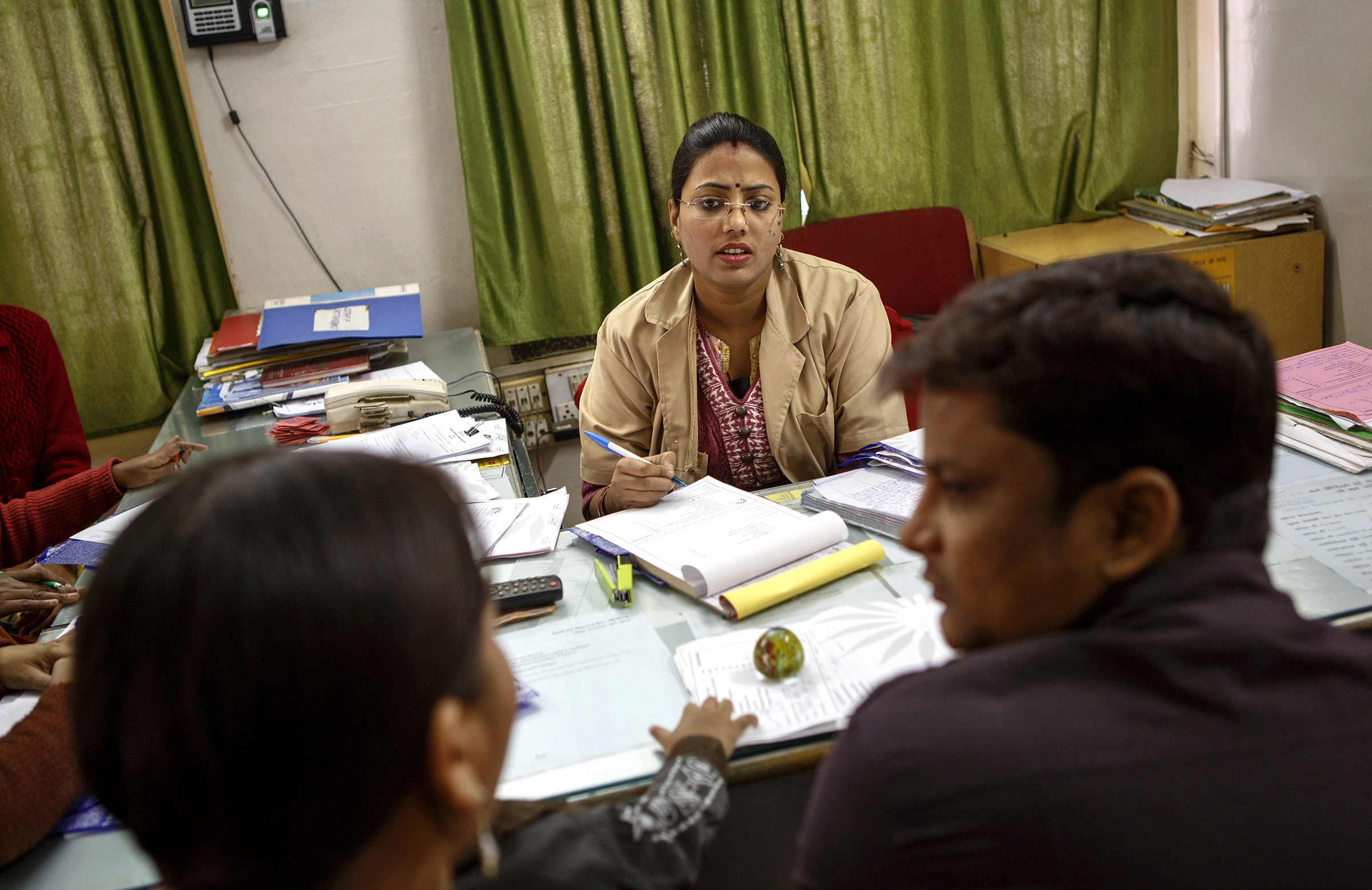 Neha Sinha, a health counselor at the Janani Surya Clinic in Patna, Bihar, advises a family on birth control options. The bulk of India’s unmet family planning needs are in the northern states - Bihar and Uttar Pradesh in particular - says Director Don Douglas. "We see women coming in all the time, age 23, 24, with 3 and 4 children already, and saying enough - I've had enough babies.” Douglas says that lack of education, especially for girls, helps to explain Bihar's high fertility. Girls are being taken out of school early and married at a young age; over half of all women in Bihar are married before age 18. "If you want to move the needle on population control, this is the epicenter," he said. SARAH WEISER