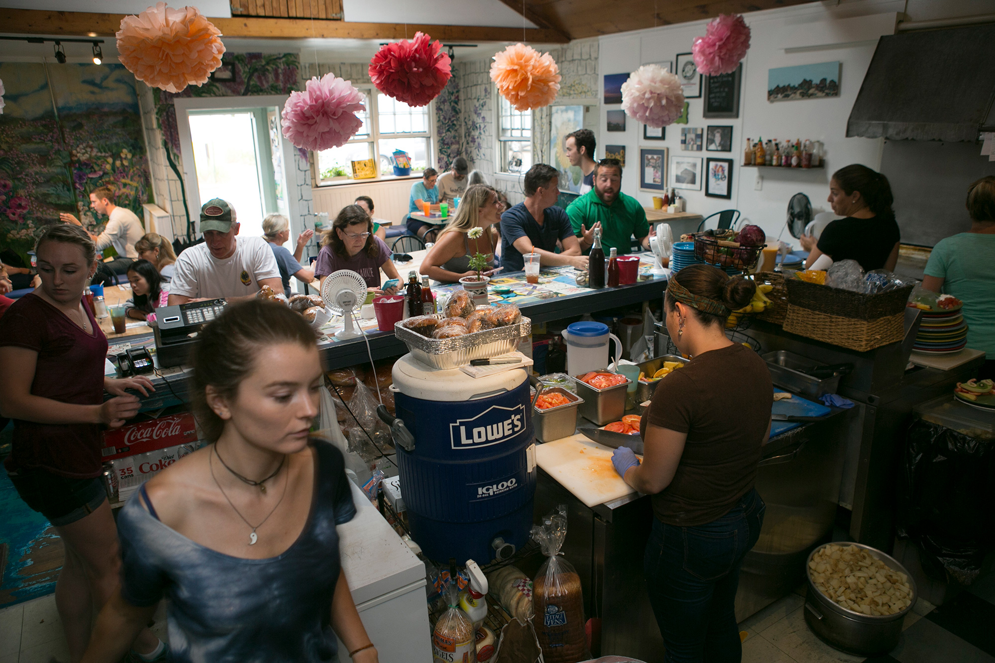 The breakfast rush at Mad Martha’s Cafe on Plum Island. The restaurant is one of several local businesses built on a fragile ecosystem of sands that are constantly shifting. It is at risk of flooding and damage from rising sea levels and intensifying storm surges. (Photo by Lauren Owens Lambert/GroundTruth)