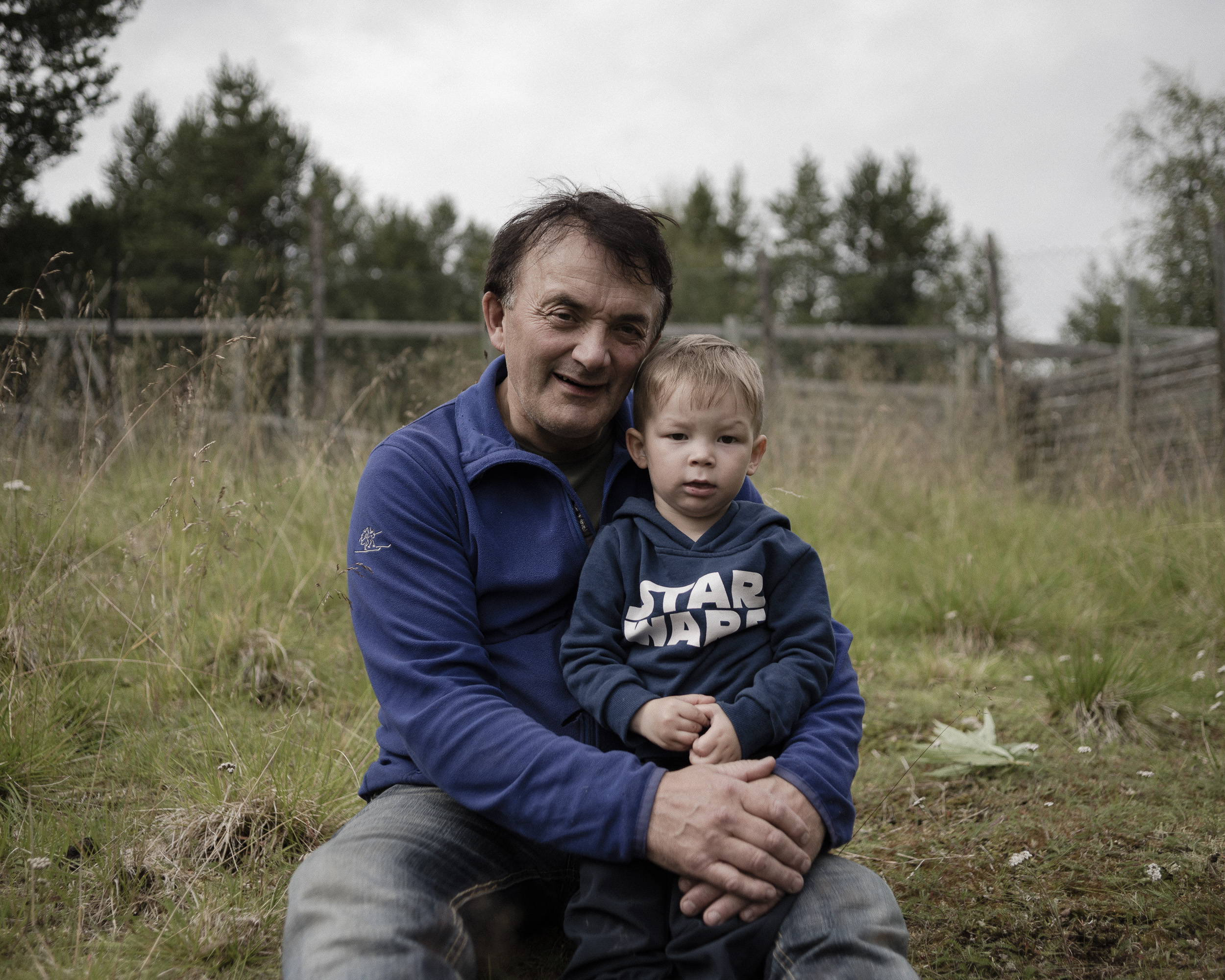 Arvid and his grandson outside of their home in Karasjok, northern Norway. (Camilla Andersen/GroundTruth)