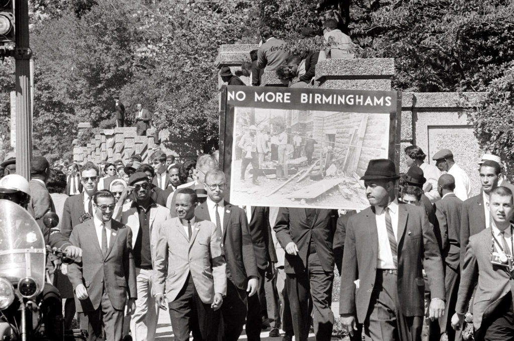 In 1963, Unitarian Universalist members of All Souls Church in Washington, D.C. march in memory of those who died in the 16th Street Baptist Church Bombing, a hate crime that killed four African American girls and injured 22 others earlier that year. (Photo by Thomas O'Halloran)