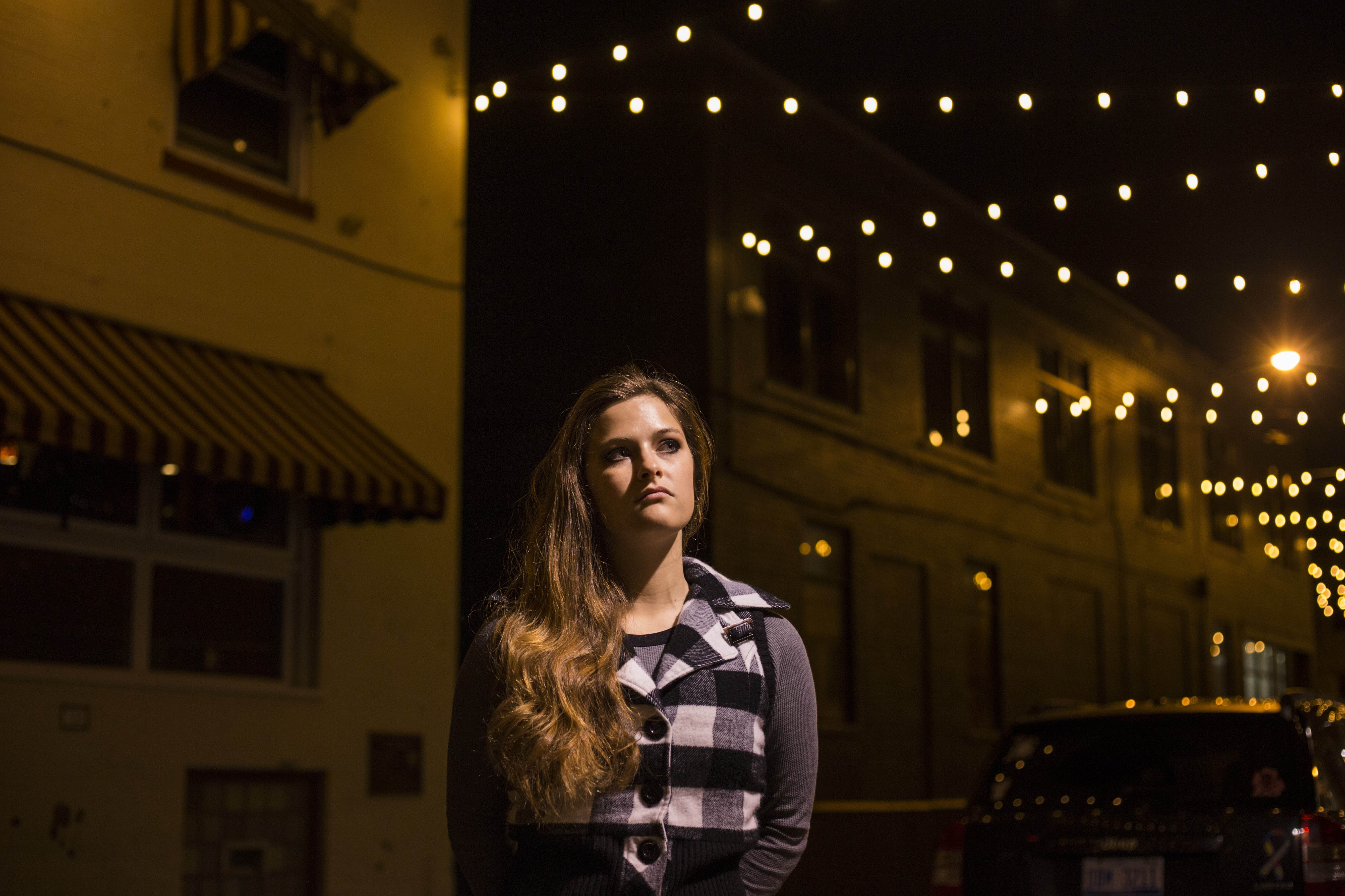 Annabelle Ward, 21, in downtown Flint, Mich., on October 23, 2016. She is a student at the University of Michigan Flint studying behavioral therapy to one day work with children with Autism. She says education is one of the most important topics she considers when voting. Originally, a Bernie Sanders supporter, she is now deciding, although reluctant at first, to back Hillary Clinton. "Clean energy and her infrastructure and taxes - I think those three things right there are so important to me but also the importance of education for children because you know children who live in poorer communities don't get the best education."