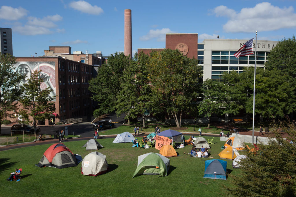 Students urged Northeastern University to divest from fossil fuels on Monday by pitching tents up on campus commons. (Photo by Alastair Pike/GroundTruth)