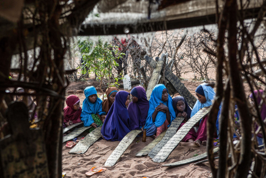 Somali children attend morning madrassa, or Islamic religious classes, in Dadaab refugee camp. (Photo by Nichole Sobecki/GroundTruth)