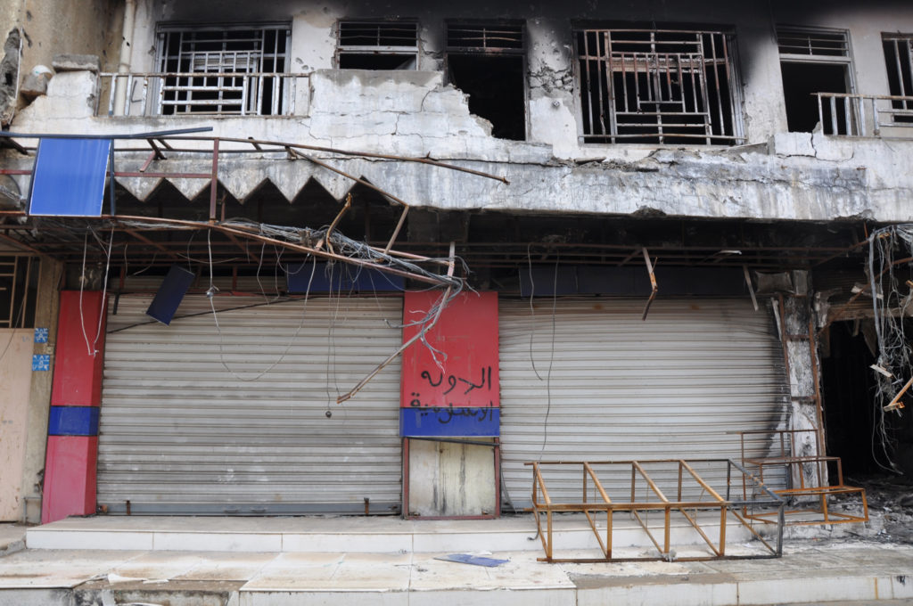 IS militants tagged buildings with their name all over Qaraqosh, Iraq's largest Christian city. (Photo by Lauren Bohn/GroundTruth)