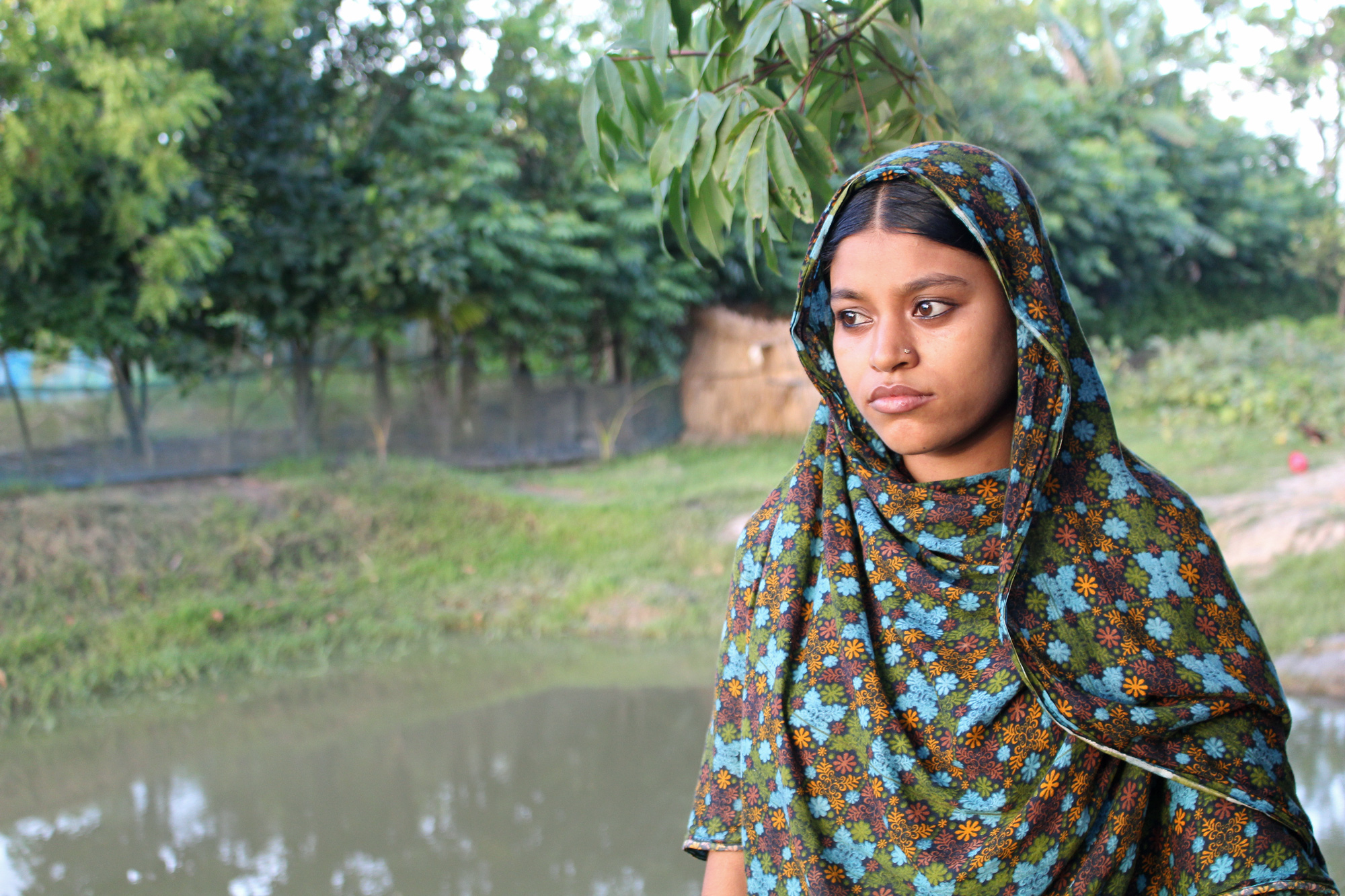 Shahina Begum, 18, moved to Kochukhali village when she got married at the age of 12. While her husband is away most of the year in Dhaka, she lives with his parents who keep strict tabs on her whereabouts. (Photo by Neha Thirani Bagri/GroundTruth)