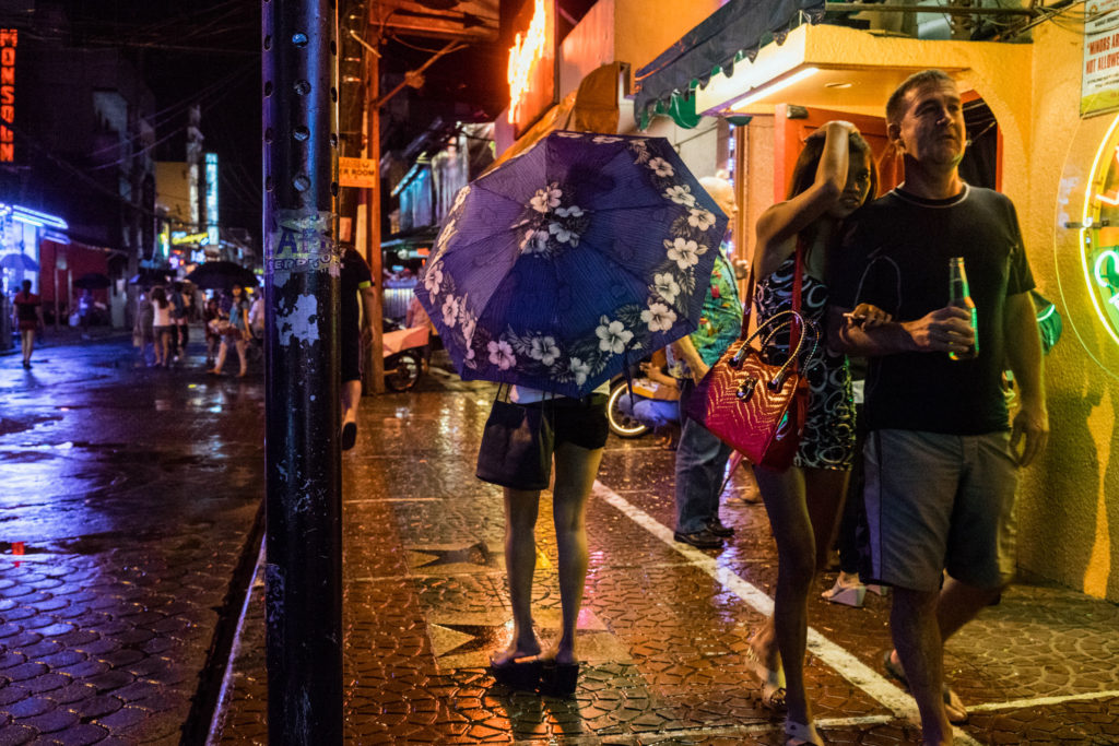 A scene from Fields Avenue, the red light district in Angeles City, notorious for its sex tourism. In the wake of typhoons, women and girls wind up in the sex trade after being displaced by storms. (Photo by Hannah Reyes Morales)