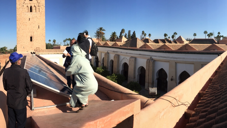 Marrakech’s Koutoubia mosque has soaked up the Moroccan sun for nearly 900 years. Now it also puts those rays to work generating clean electricity. (Photo by Chris Bentley/GroundTruth)