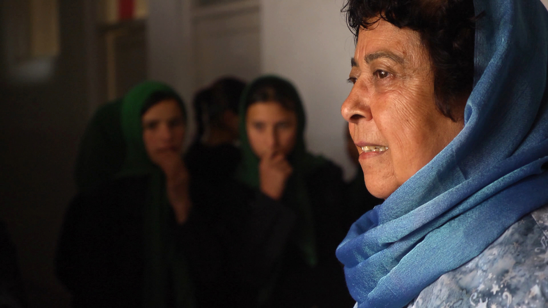 Razia Jan greets students at the Zabuli Education Center, a K-12 girls' school in Afghanistan. (Photo by Beth Murphy/GroundTruth)