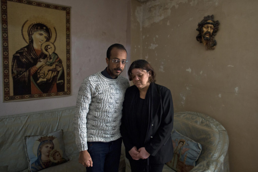 The wife and son of Faheem Nassim, who died during a suicide bombing in St. Markos Church in Egypt. (Photo by Roger Anis/GroundTruth)