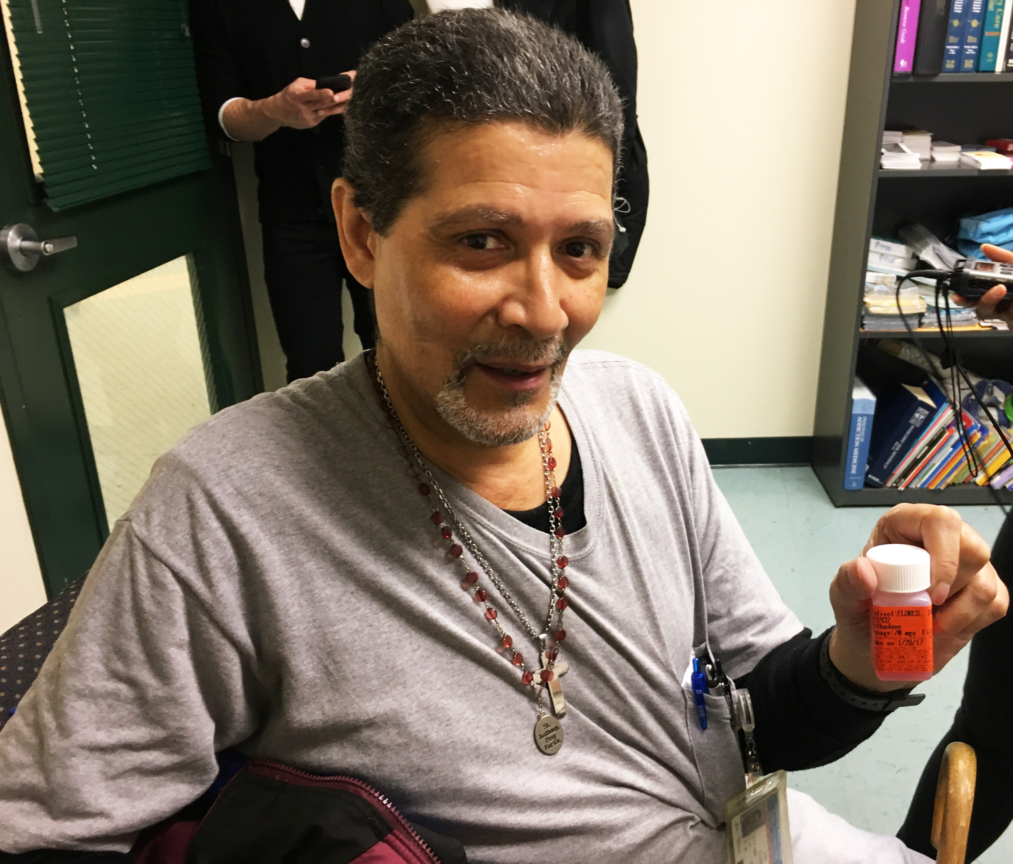 Ivan Flores holds a take-home bottle of methadone at Montefiore Hospital’s Wellness Center at Port Morris on Jan. 27, 2017. (Photo by Michael O’Brien/GroundTruth)