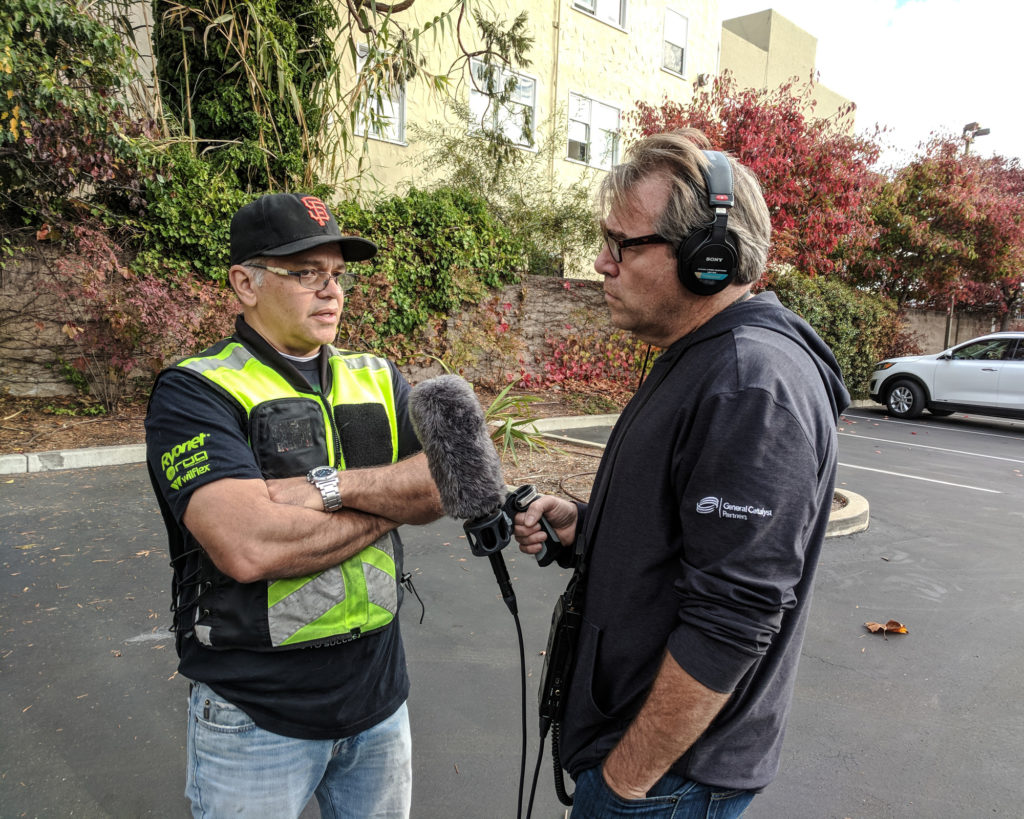 JC shares his story with Charles Sennott, founder of The GroundTruth Project. (Photo by Ben Brody)