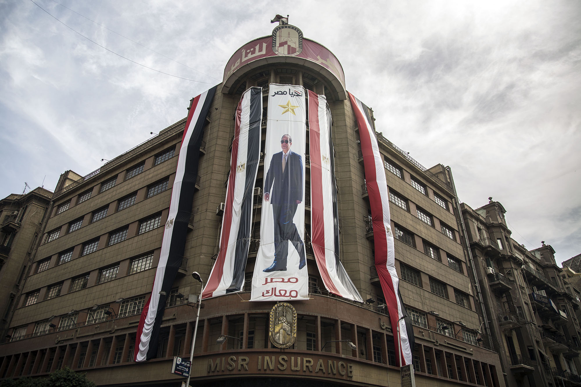 A Sisi banner hangs in Cairo. After a democratic election in 2012 that put the Muslim Brotherhood in power, Sisi led a coup that overthrew the democratically-elected president, and banned the Muslim Brotherhood and pro-democracy demonstrators. (Roger Anis/GroundTruth)