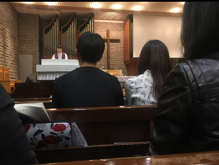 Rev. Peter Choi addresses students at Yonsei University church during mass. (Tommy Brooksbank/GroundTruth)