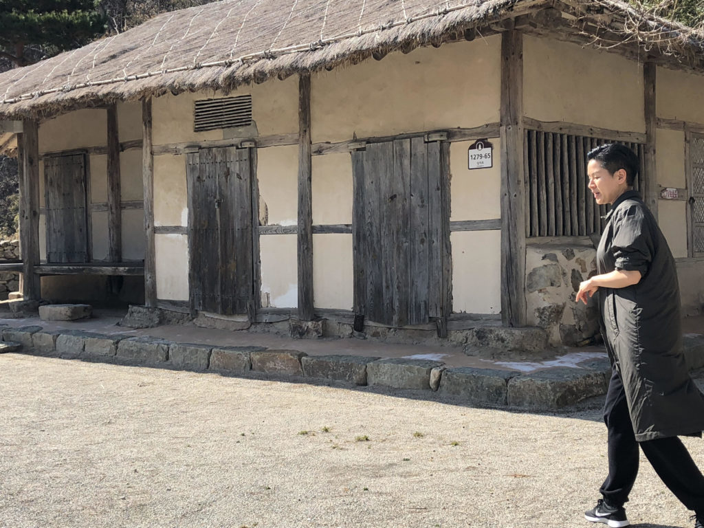 Won Buddhist minister Grace Song shows the childhood home of the religion's founder, Sotaesan. It's designated as the sacred ground where the religion was founded in Yeonggwang, Korea. (Sherry Simpson/GroundTruth)