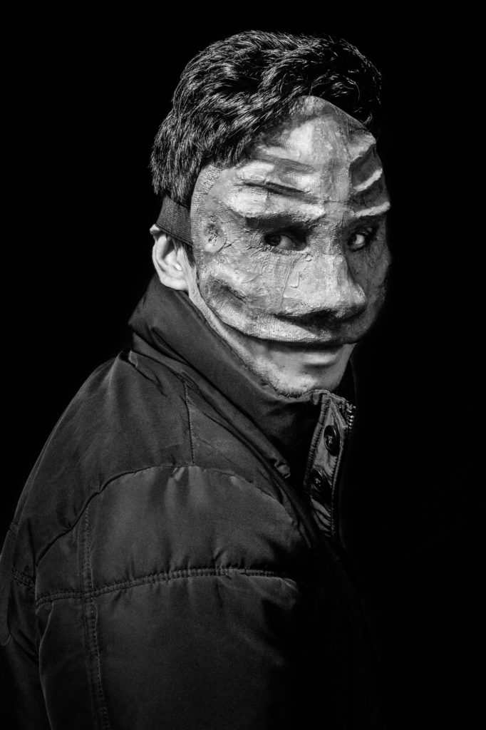 Arifullah "Arif" Fana — a 27-year-old Afghan man living at La Bulle — wears a mask he made in a Good Chance workshop. Arif, who speaks six languages, came to Good Chance's workshops nearly every day. “I was a Thaï boxing teacher back in Afghanistan," he said. "In the dome, I have been able to give some Thaï boxing lessons and it felt great." (Photo by Annabelle Marcovici/GroundTruth)