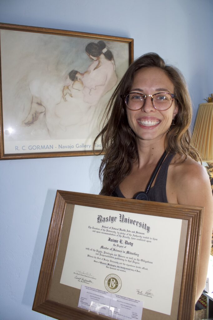 Doty earned her Master of Science degree in Midwifery from Bastyr University, which she proudly displays in her home office. (Photo by Kylea Henseler/GroundTruth)